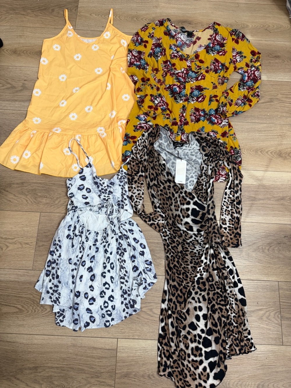Bundle of Four Women’s Dresses/Romper Size Medium